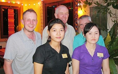 Tuesday’s top three (standing rear) pose with staff members at The Relax Bar.